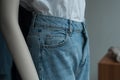 blue jean and white teeshirt on mannequin in women fashion store showroom