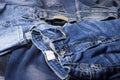 Blue jeans background overlapping Modern fashion jeans - top view
