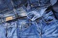 Blue jeans background overlapping Modern fashion jeans - top view