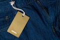 Blue jeans with blank brown label tag Royalty Free Stock Photo