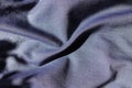 Blue jeans fabric shot with violet in folds Royalty Free Stock Photo