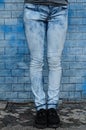 Blue jeans in front of a blue wall