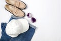 Blue jeans, gery hoody, beige suede loafer or flat shoes lying on white background Royalty Free Stock Photo