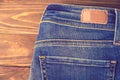 Blue jeans with half of back pocket and brown leather tag Royalty Free Stock Photo