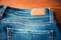 Blue jeans with half of back pocket and brown leather tag Royalty Free Stock Photo