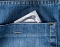 Blue jeans hip-pocket with condom in it Royalty Free Stock Photo
