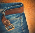 Blue jeans with a leather belt Royalty Free Stock Photo