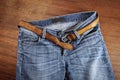 Blue jeans with leather belt. Royalty Free Stock Photo