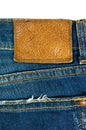 Blue jeans with leather label on white Royalty Free Stock Photo