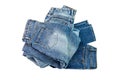 Blue jeans lined in a pile of jeans elements modern women's and men's fashion pants isolated cut-out background