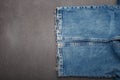 blue jeans, parts of clothes on grey background, closeup, copy space Royalty Free Stock Photo