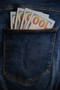 Blue jeans pocket with hundred dollars banknotes Royalty Free Stock Photo
