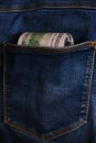 Blue jeans pocket with hundred dollars banknotes Royalty Free Stock Photo