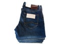 Blue Jeans Stack with Label on white Background Royalty Free Stock Photo