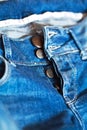 Blue jeans with unfasten buttons closeup Royalty Free Stock Photo