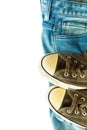 Blue jeans and vintage sneakers. Royalty Free Stock Photo