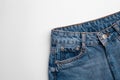 Blue jeans on white background. Top view of jeans pants with space for text Royalty Free Stock Photo