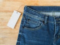 Blue jeans with white blank price tag Royalty Free Stock Photo