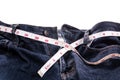 Blue Jeans and white measuring tape on white background.diet