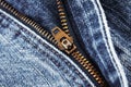 Blue jeans zip zipper close up detail with selective focus Royalty Free Stock Photo
