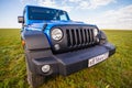 Blue Jeep Wrangler Rubicon Unlimited in steppe near Utta village.