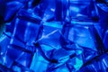 Blue Jell-O gelatin cubes lit from below.