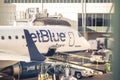 Blue JetBlue plane at the Charlotte North Carolina airport landing area