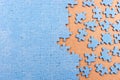 Blue jigsaw puzzle with copy space. Connected and missing blank puzzle pieces Royalty Free Stock Photo