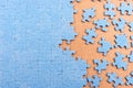 Blue jigsaw puzzle with copy space. Connected and missing blank puzzle pieces Royalty Free Stock Photo