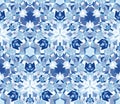 Blue kaleidoscope seamless pattern. Seamless pattern composed of color abstract elements located on white background. Royalty Free Stock Photo