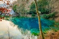 Blue karst spring `Blautopf` with the hammermill and the Blaubeuren Abbey Royalty Free Stock Photo