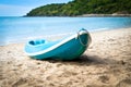 Blue kayak on sandy beach Royalty Free Stock Photo