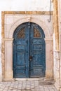 A blue keyhole, or Moorish, arch door on a house near the Tunis Souk
