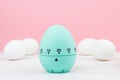 Blue kitchen egg timer on a pink background. cooking time, soon Easter Royalty Free Stock Photo