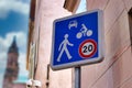 Blue 20km/h Home Zone speed limit sign showing car, bicycle and pedestrian in French street Royalty Free Stock Photo