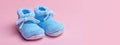 blue knitted baby booties. Selective focus. Royalty Free Stock Photo