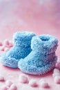 blue knitted baby booties. Selective focus. Royalty Free Stock Photo