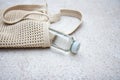 Blue knitted bag handmade and a bottle of water outdoors. Sustainable shopping. Waste-free lifestyle Royalty Free Stock Photo