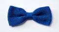 Blue Knitted Bow Tie On White Background - Handcrafted Gift For Veterans Day
