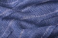 Blue knitted fabric texture close up. Can be used as a background. Selective focus Royalty Free Stock Photo