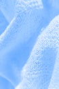 Blue knitted fabric texture closeup. Royalty Free Stock Photo