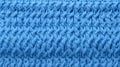 Blue knitted texture. Knitted background. Close-up of a knitted pattern Royalty Free Stock Photo