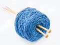 Blue knitting yarn on white background