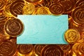 Blue kraft paper postcard in gold coins heap Royalty Free Stock Photo