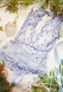 Blue lace bodysuit on the white background. Lace women& x27;s lingeri