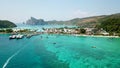 Blue lagoon. Bay with clear sea. Green island with palm trees, Paradise. Drone footage. Royalty Free Stock Photo