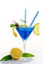 Blue lagoon cocktail with blue curacao liqueur, vodka, lemon juice and soda. Blue cocktail in martini glasses on black background Royalty Free Stock Photo