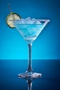 blue lagoon cocktail drink in cocktail glass on blue background Royalty Free Stock Photo