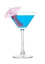 Blue lagoon cocktail in martini glass with sweet cherry and umbrella on white Royalty Free Stock Photo