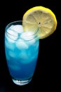 Blue lagoon cocktail with slice of lemon isolated on black Royalty Free Stock Photo